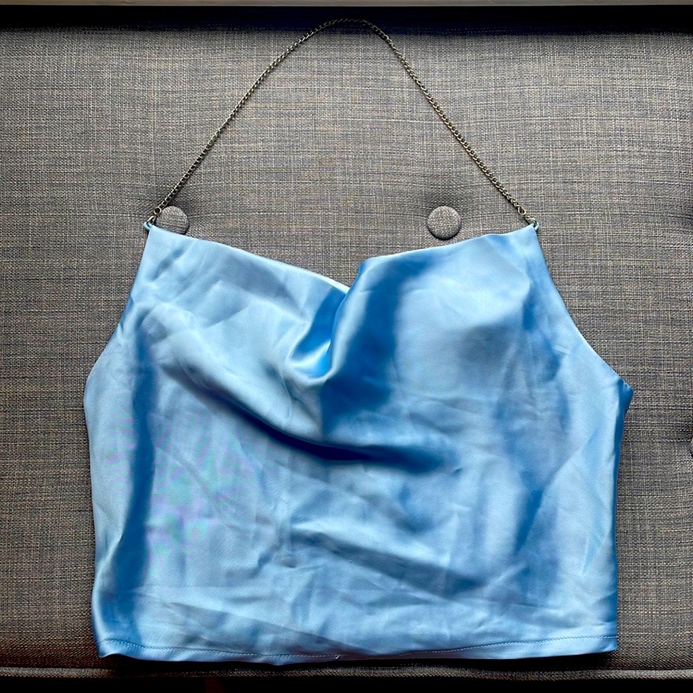 Such a cute expensive but cheap looking top great material size small